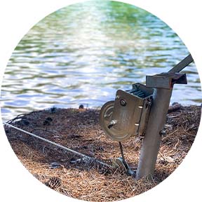 Custom dock equipped with a cable and winch system by Kroeger Marine, designed for easy boat lift and secure docking