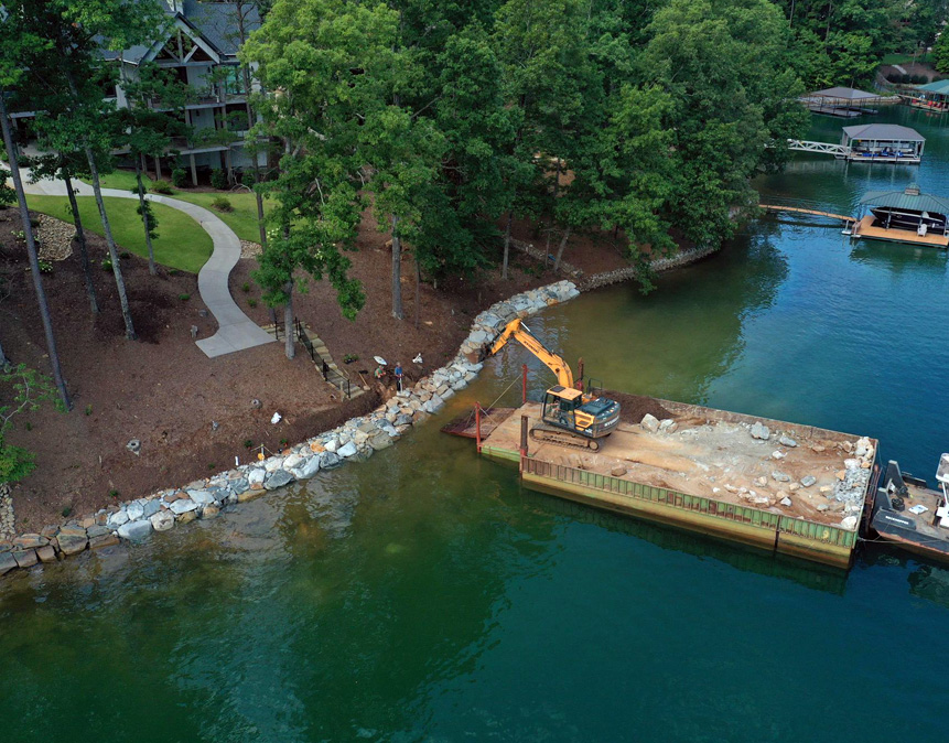 Shoreline protection using erosion control techniques with riprap stones, preserving the natural lakefront