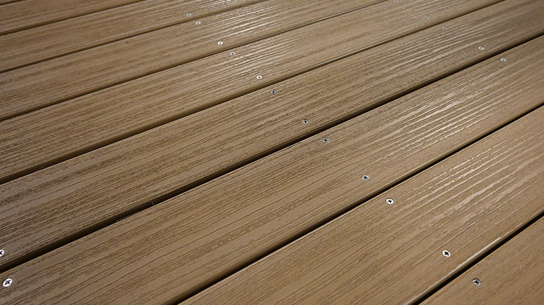 Custom dock with Fiberon Paramount decking by Kroeger Marine, providing durable and moisture-resistant composite decking for lasting beauty