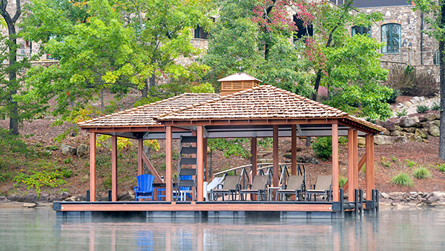 Custom dock with hip and a half roof design by Kroeger Marine, combining elegant style with expanded roof coverage for added versatility